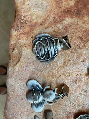 PEWTER CURTAIN HANGERS AND GLASS BUG WIND-CHIME