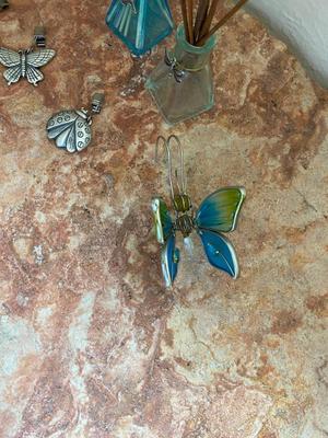 PEWTER CURTAIN HANGERS AND GLASS BUG WIND-CHIME