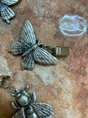 PEWTER CURTAIN HANGERS AND GLASS BUG WIND-CHIME