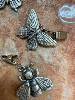 PEWTER CURTAIN HANGERS AND GLASS BUG WIND-CHIME