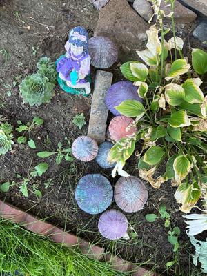 CONCRETE MUSHROOMS AND A LITTLE GIRL YARD ART
