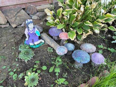 CONCRETE MUSHROOMS AND A LITTLE GIRL YARD ART