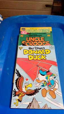 LOT 34 - THREE VINTAGE WALT DISNEY COMIC BOOKS