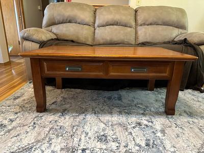 LIFT COFFEE TABLE WITH SOME LOSS OF FINISH TO THE TOP