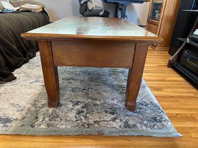 LIFT COFFEE TABLE WITH SOME LOSS OF FINISH TO THE TOP