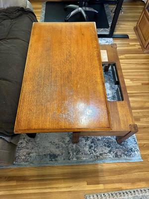 LIFT COFFEE TABLE WITH SOME LOSS OF FINISH TO THE TOP