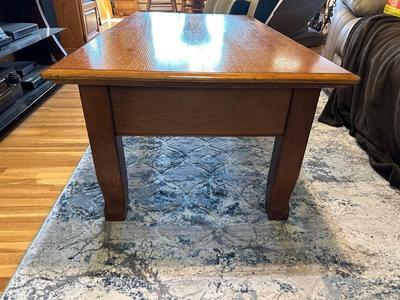 LIFT COFFEE TABLE WITH SOME LOSS OF FINISH TO THE TOP