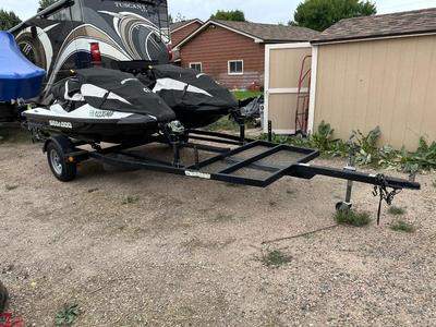 TWO 2013 SEA-DOO JET SKIS WITH TRAILER