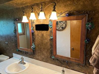 2 WALL MIRRORS WITH A WOOD & IRON FRAMES PLUS A MATCHING ROUND WALL DECOR