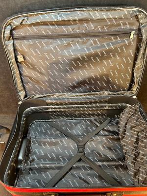 Lot 124. Roller Suitcase