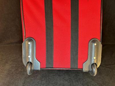 Lot 124. Roller Suitcase