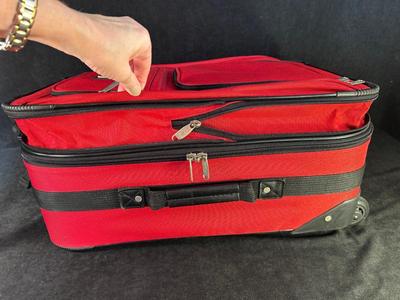 Lot 124. Roller Suitcase