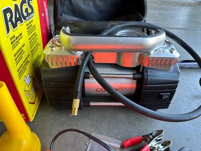 GSPSCN PROFESSIONAL TIRE INFLATOR, LUG NUTS, OIL AND FUEL FILTER, GLOVES, MUFFLER CLAMP AND OTHER ITEMS