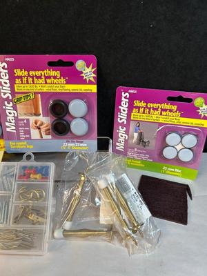 Lot 30. Misc hdwe: chair slides, door bumpers