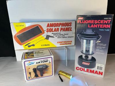 Lot 104. Coleman Lantern, Solar Panel, Air Pump