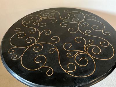 Black lacquered gold embossed round table