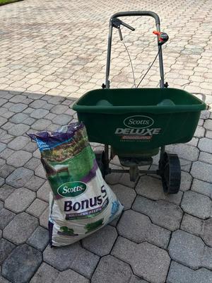 Lot 179. Push Spreader and Weed & Feed