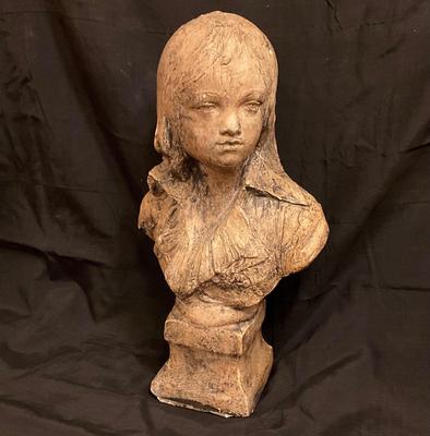 Beautiful young lady statue made of plaster