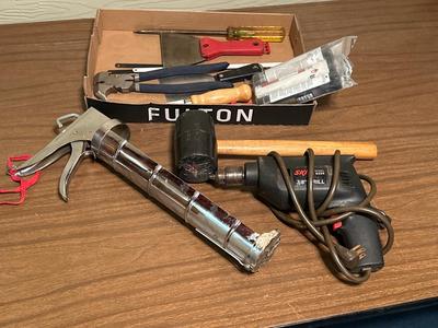 Mallet and caulk gun