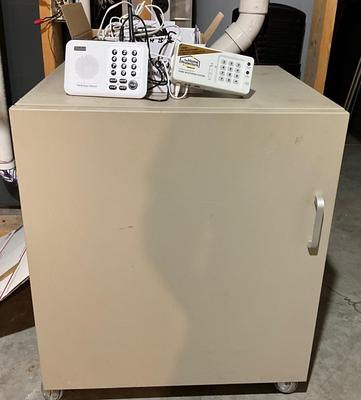 Metal cabinet with wireless income system