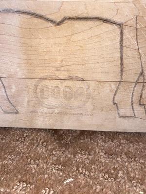 ARNOLD THE HAWG ON A CO-OP CUTTING BOARD AND BABY HAM HITCHING A RIDE ON MAMA PIG