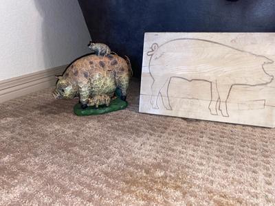 ARNOLD THE HAWG ON A CO-OP CUTTING BOARD AND BABY HAM HITCHING A RIDE ON MAMA PIG