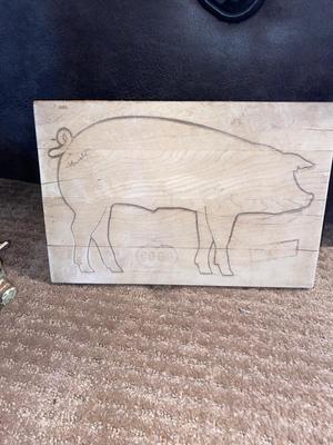 ARNOLD THE HAWG ON A CO-OP CUTTING BOARD AND BABY HAM HITCHING A RIDE ON MAMA PIG