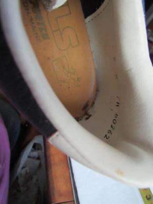 Older Pair Golf Shoes