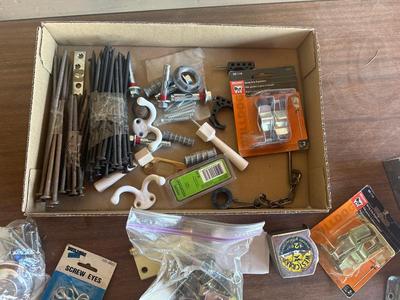 Screws, coat hangers, tape measure