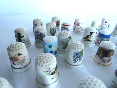 Large Lot Porcelain and Other Thimbles, Little Fabric Flowers, Curled Needles