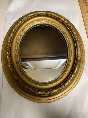 Antique Oval Gold Leaf Painted Mirror w/Wooden Back 12.25" Wide x 14.50" Tall in Good Preowned Condition.