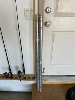 2 FISHING POLES W/REELS, 2 POLE TUBES AND A NYLON BAG