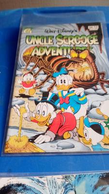 LOT 94 - THREE WALT DISNEY COMIC BOOKS