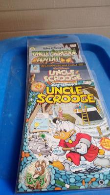 LOT 94 - THREE WALT DISNEY COMIC BOOKS