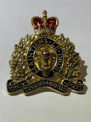 Scarce RCMP Royal Canadian Mounted Police Cap Badge -Gilt & Enameled in VG Preowned Condition.