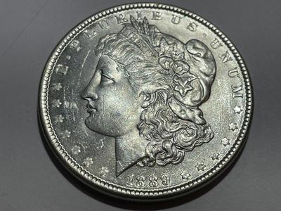 1889-P UNCIRCULATED CONDITION MORGAN SILVER DOLLAR AS PICTURED.