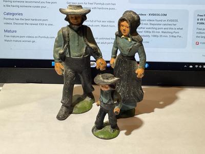 Vintage Mid-Century Cast Iron Amish Family Figurines in Good Preowned Condition.