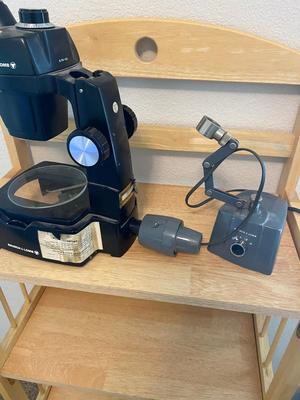 BOUSCH & LOMB MICROSCOPE WITH EXTERNAL LIGHT , ELECTRICAL ISOLATOR, AND EXTERNAL EXTENSION CORD