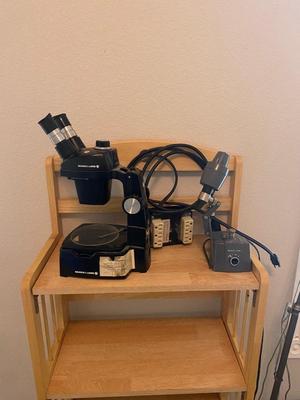 BOUSCH & LOMB MICROSCOPE WITH EXTERNAL LIGHT , ELECTRICAL ISOLATOR, AND EXTERNAL EXTENSION CORD