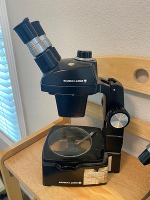 BOUSCH & LOMB MICROSCOPE WITH EXTERNAL LIGHT , ELECTRICAL ISOLATOR, AND EXTERNAL EXTENSION CORD