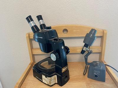 BOUSCH & LOMB MICROSCOPE WITH EXTERNAL LIGHT , ELECTRICAL ISOLATOR, AND EXTERNAL EXTENSION CORD
