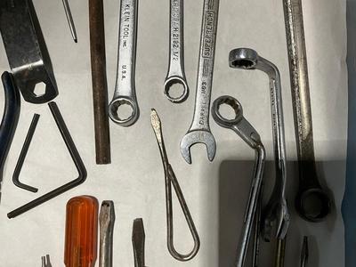 Combination of screw drivers, wrenches