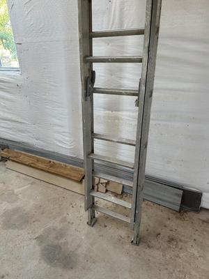 VERY TALL ALUMINUM EXTENSION LADDER WITH WALL SUPPORT