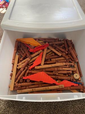 A CONTAINER OF LINCOLN LOGS