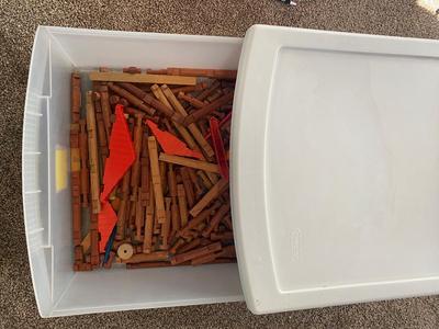 A CONTAINER OF LINCOLN LOGS