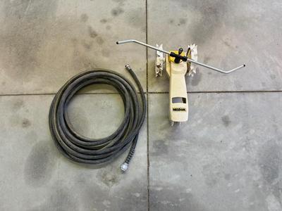 TRACTOR SPRINKLER AND A GARDEN HOSE