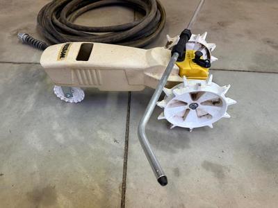 TRACTOR SPRINKLER AND A GARDEN HOSE