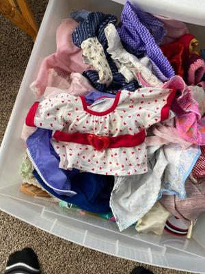 CHILD SIZE ROCKING CHAIR AND TOTE FULL OF DOLL CLOTHES