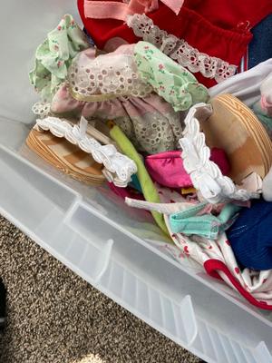 CHILD SIZE ROCKING CHAIR AND TOTE FULL OF DOLL CLOTHES
