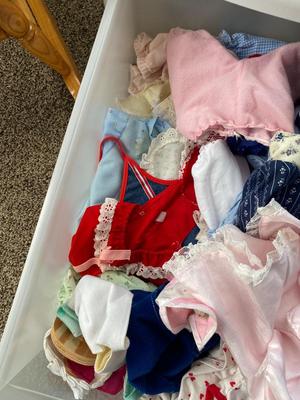 CHILD SIZE ROCKING CHAIR AND TOTE FULL OF DOLL CLOTHES
